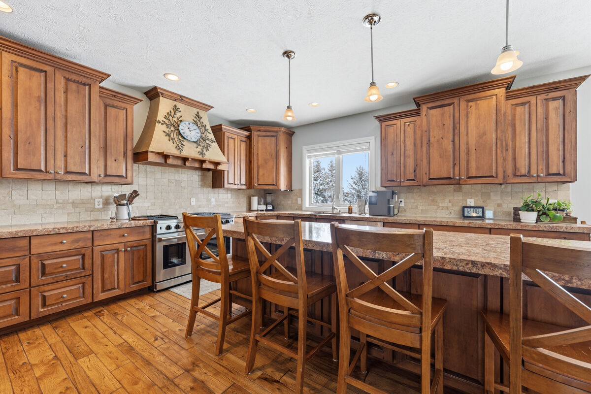 Gourmet kitchen with marble countertops and professional range