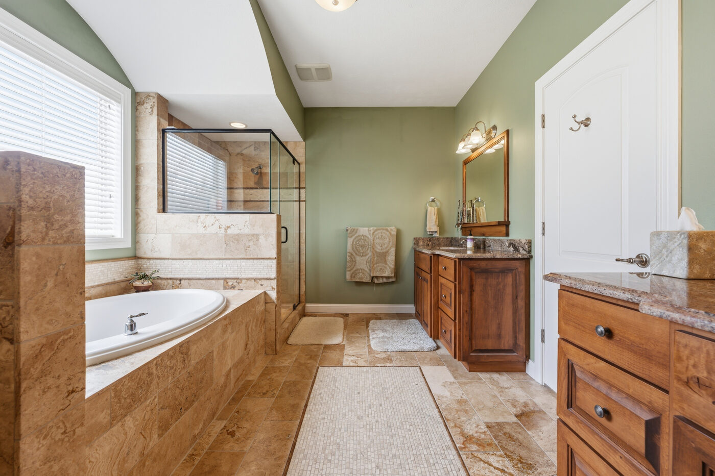 Primary bathroom with soaking tub and glass shower